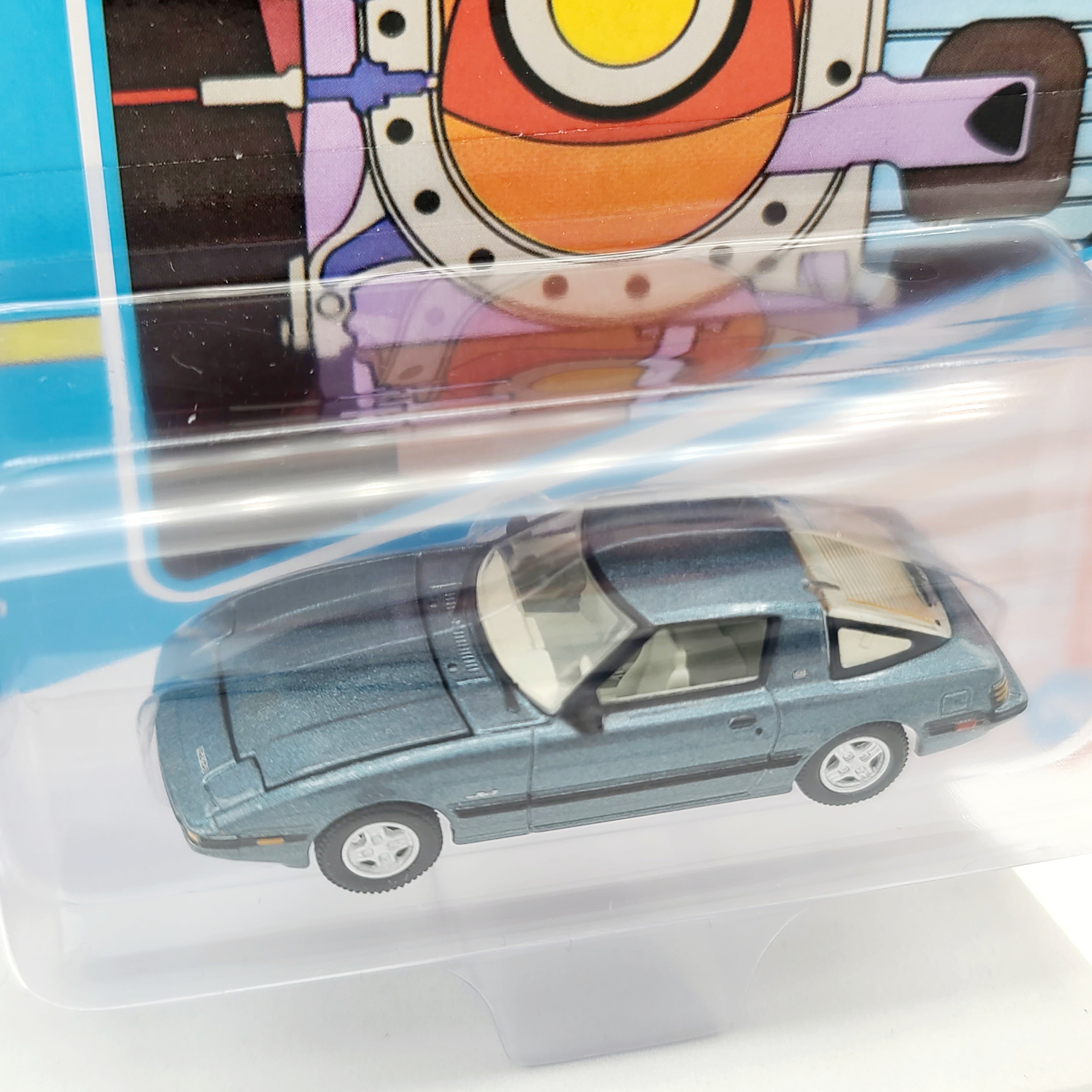 Johnny Lightning '85 Mazda RX-7 - 1:64, Tender Blue (2025 Classic Gold Release 2 B)